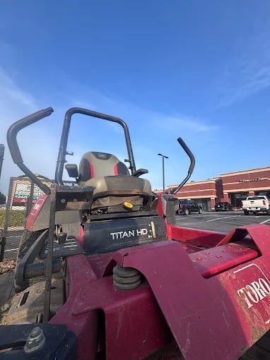 Professional lawn care Titan HD zero-turn mower parked in parking lot